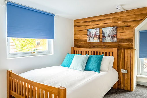 Feature wood cladding in bedroom