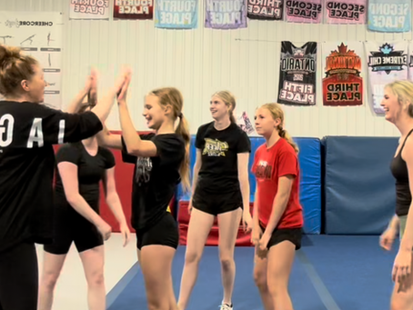 Coach supporting an athlete with a high five 