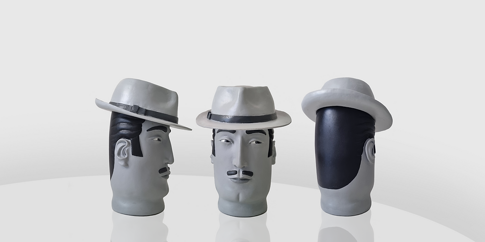 vase sculpture of a black en white male wearing a hat