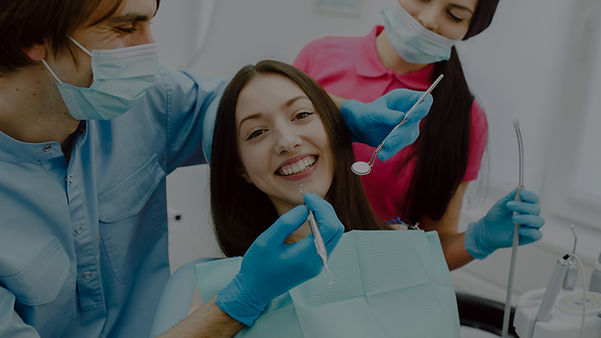 dentist-working-with-his-assistant_edited.jpg