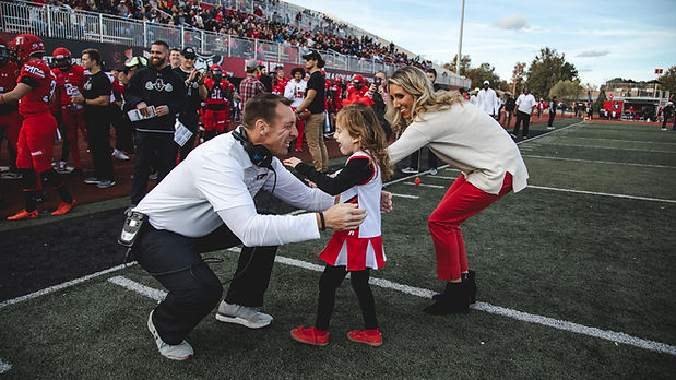 Landrey as honorary captain greeting her Dad as an Ofeensive Coordinator at Austin Peay