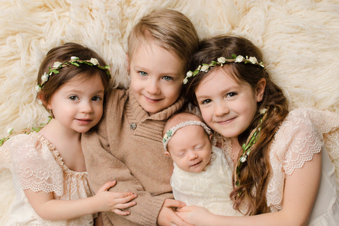 Newborn with older siblings