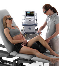 A patient receiving Cold Laser Treatment to her knee