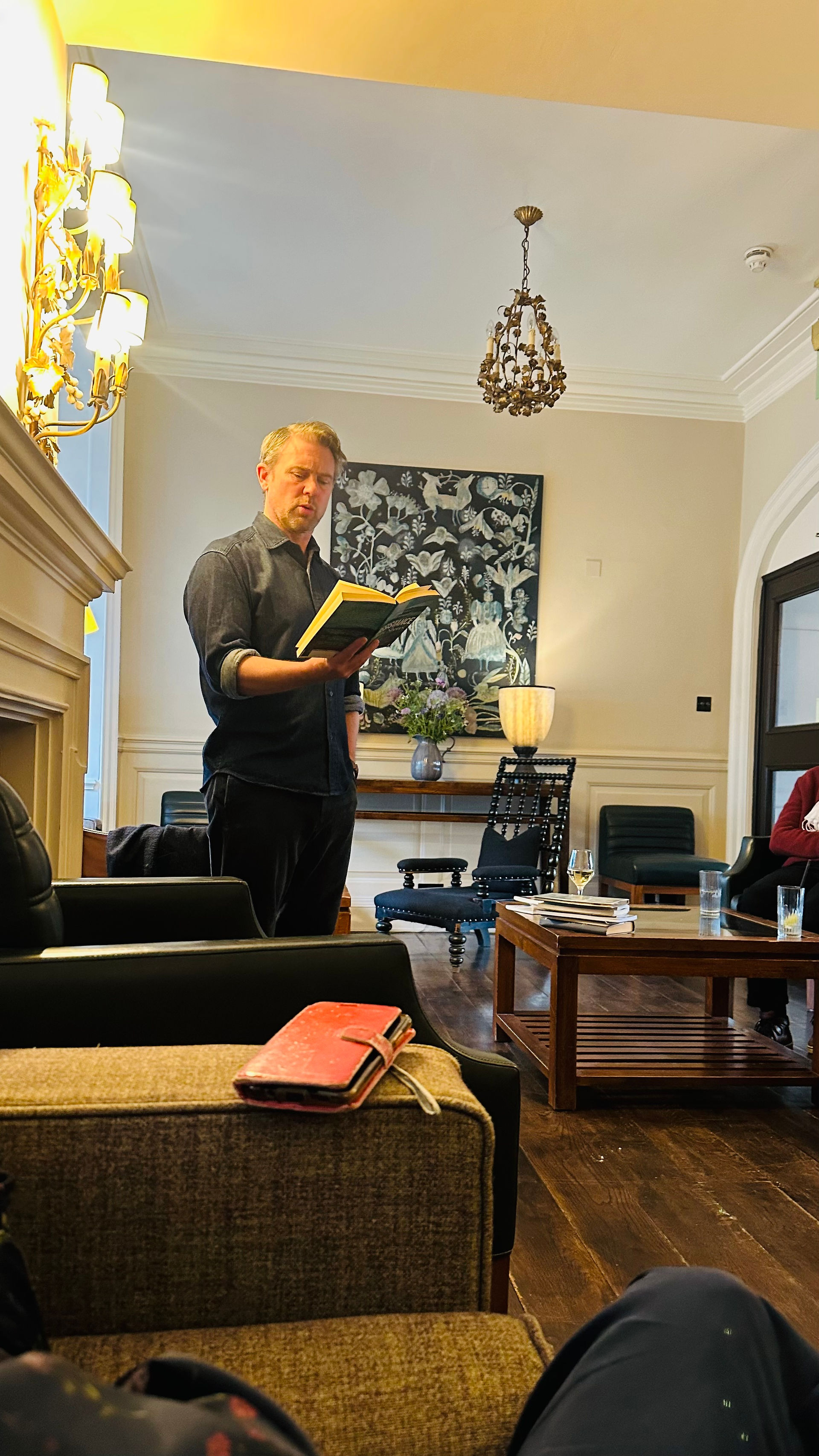 Owen Sheers poet reading to a group inside