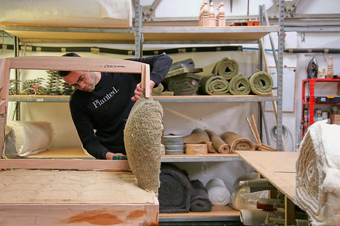 Upholsterer in our Cheltenham upholstery workshop making bespoke sofa