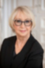 Headshot of a woman wearing glasses