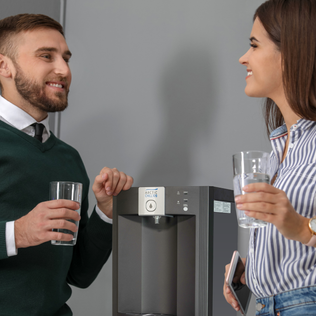 Man and woman enjoying a glass of water from an arctic chill 109