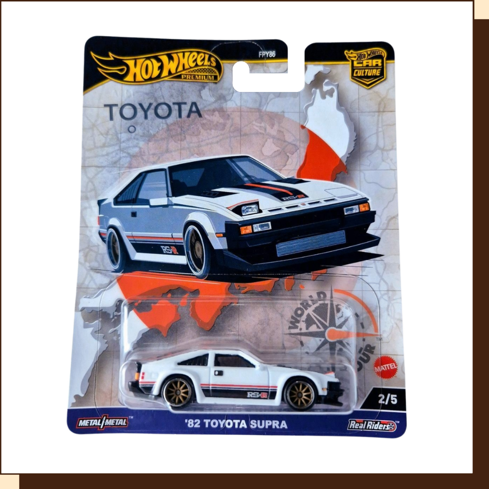 Hot Wheels Toyota Supra diecast car, white and grey color scheme. '82 TOYOTA SUPRA.