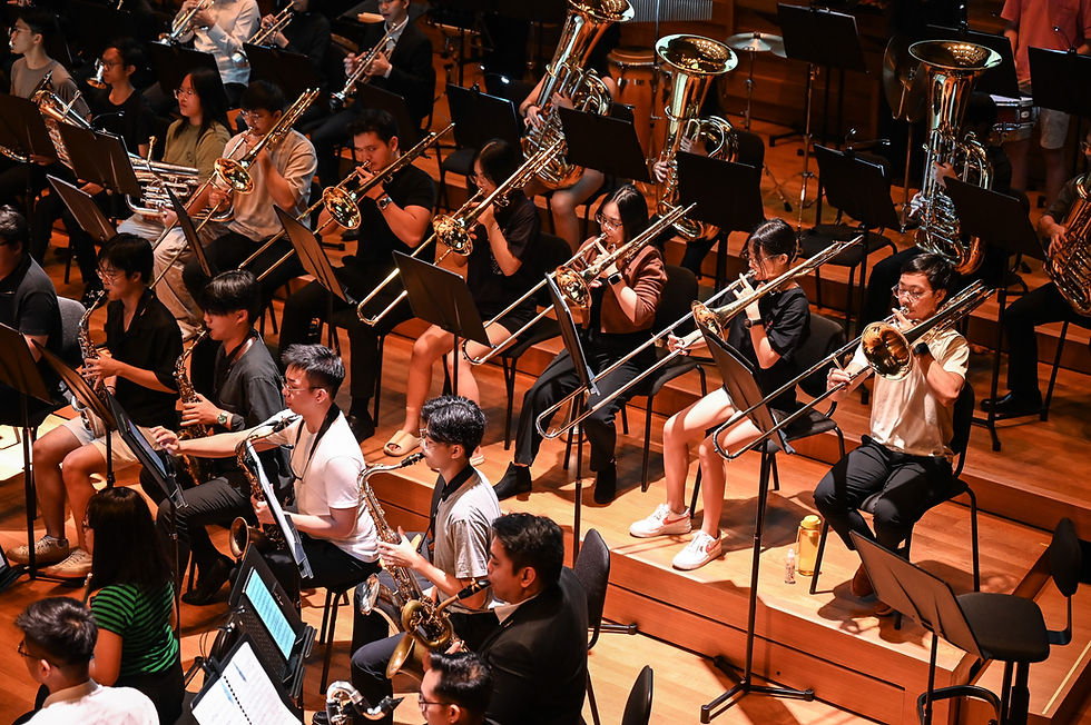 Students performing together in a school wind band.