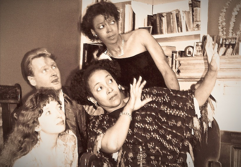 four people looking at a ghost