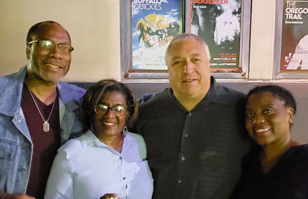 two men and two women smiling for the camera