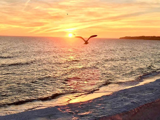 A bright sunset on the beach in algarve, portugal