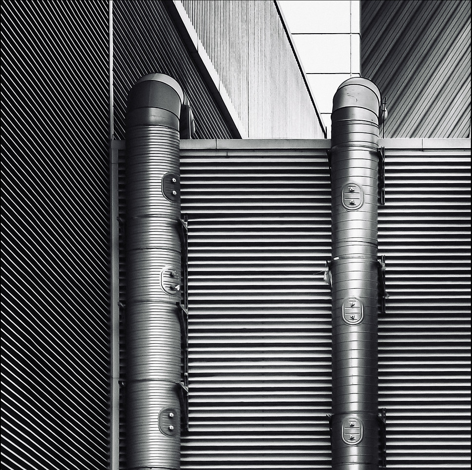 A monchrome image of vents and pipes from the Luminara series.