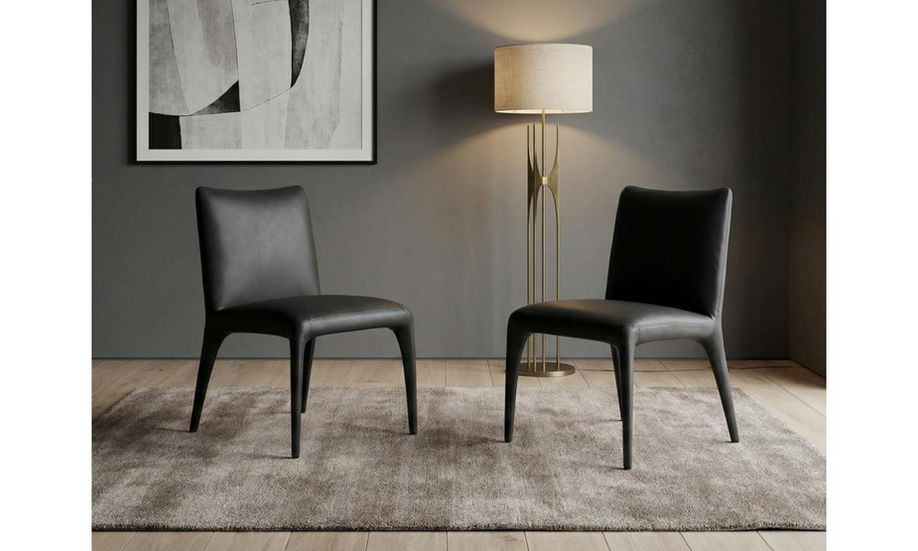 Two black eco-leather Hollis Dining Chairs in a modern room