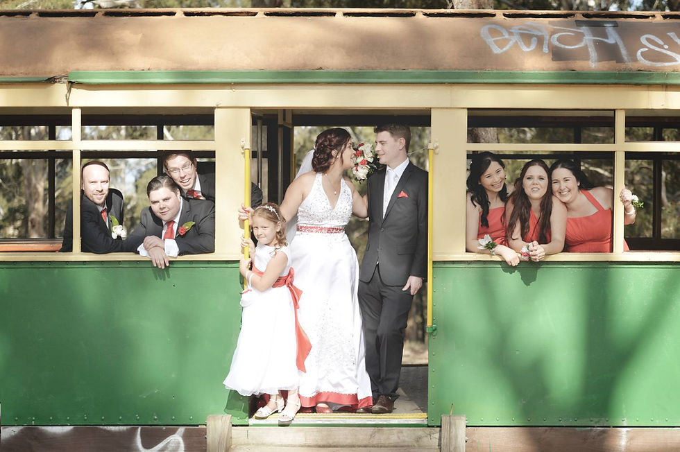 Wedding couple and guests in a green tram