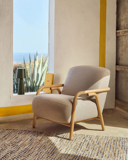 Caldris Armchair with wooden frame near a window