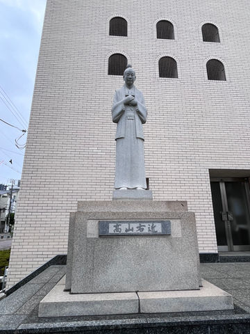 Statue of Hosokawa Takayama Ukon on the left side of the front of the church