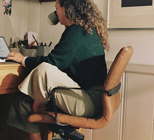 Woman working at desk with coffee_edited
