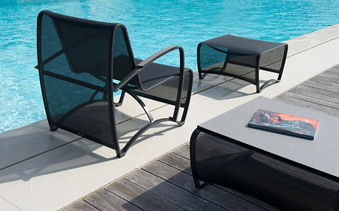Outdoors chair by the pool with otoman and side table in black color by Jardinico, Jet Stream series