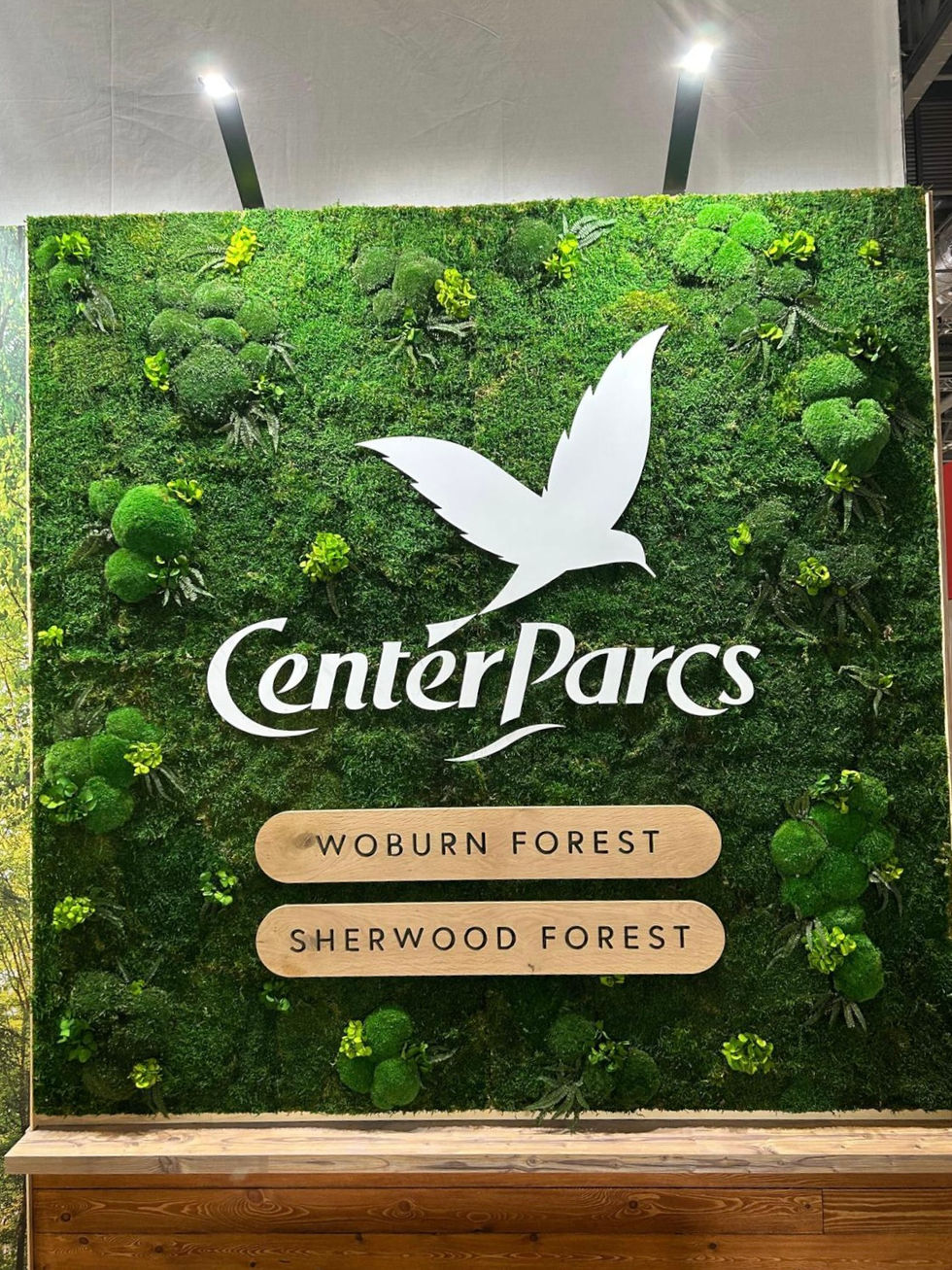 Moss wall with corporate signage