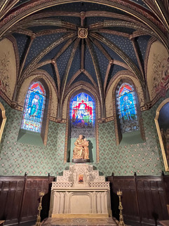 Very beautiful marble altar, statue and magnificent stained-glass windows in this church in Toulouse.