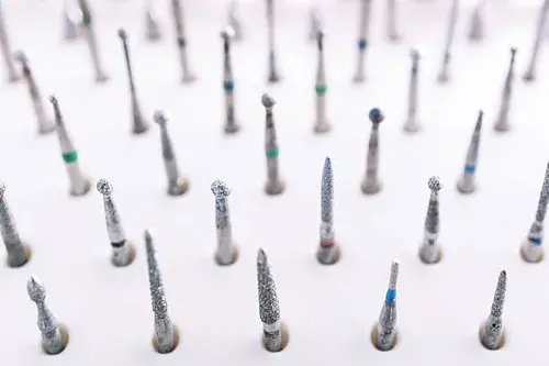 Eye-level view of dental burs in a sterilisation tray