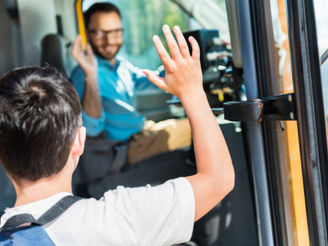 Bus driver waving