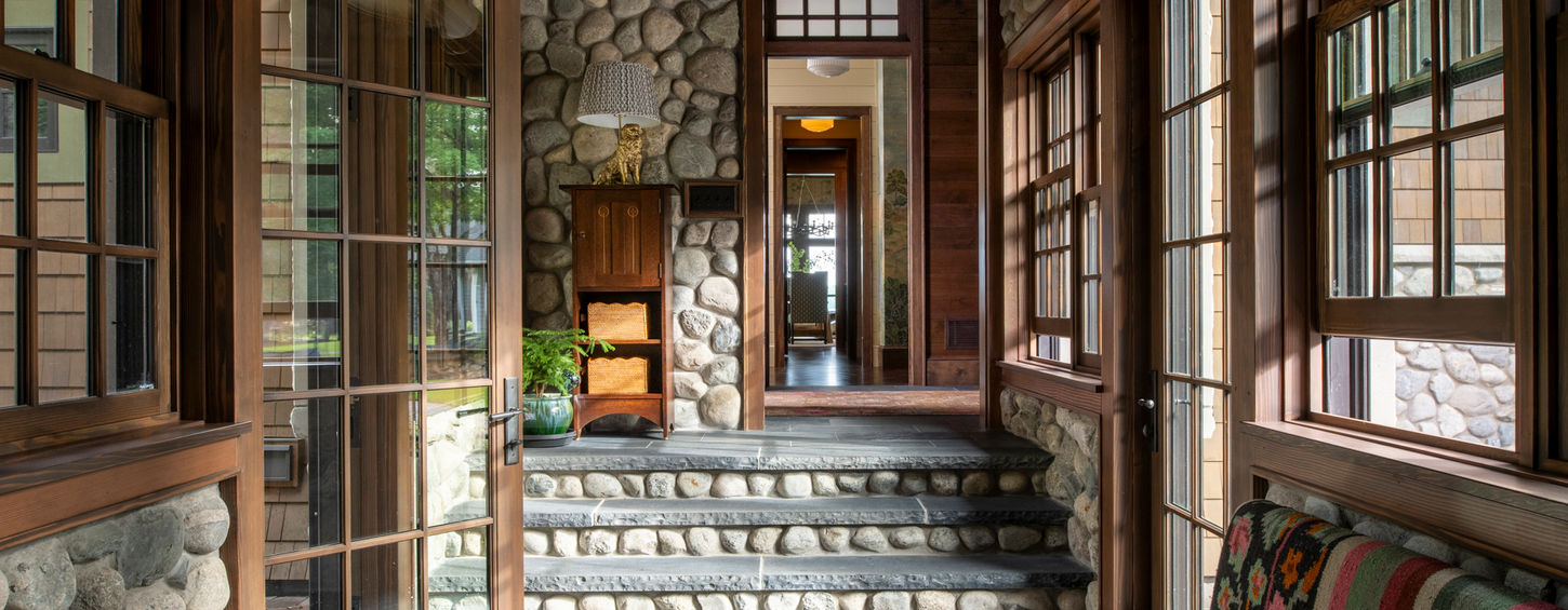 large entryway with stone and wood accents