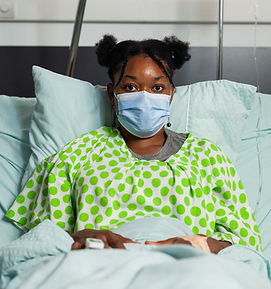 portrait-sick-young-woman-resting-bed-medical-consultation-wearing-protective-face-mask-pr