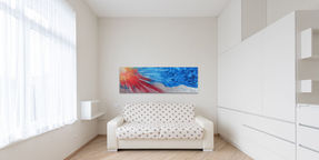 Abstract painting above the bed