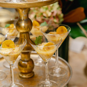 elevated shrimp and grits hors d'oeuvres in a martini glass