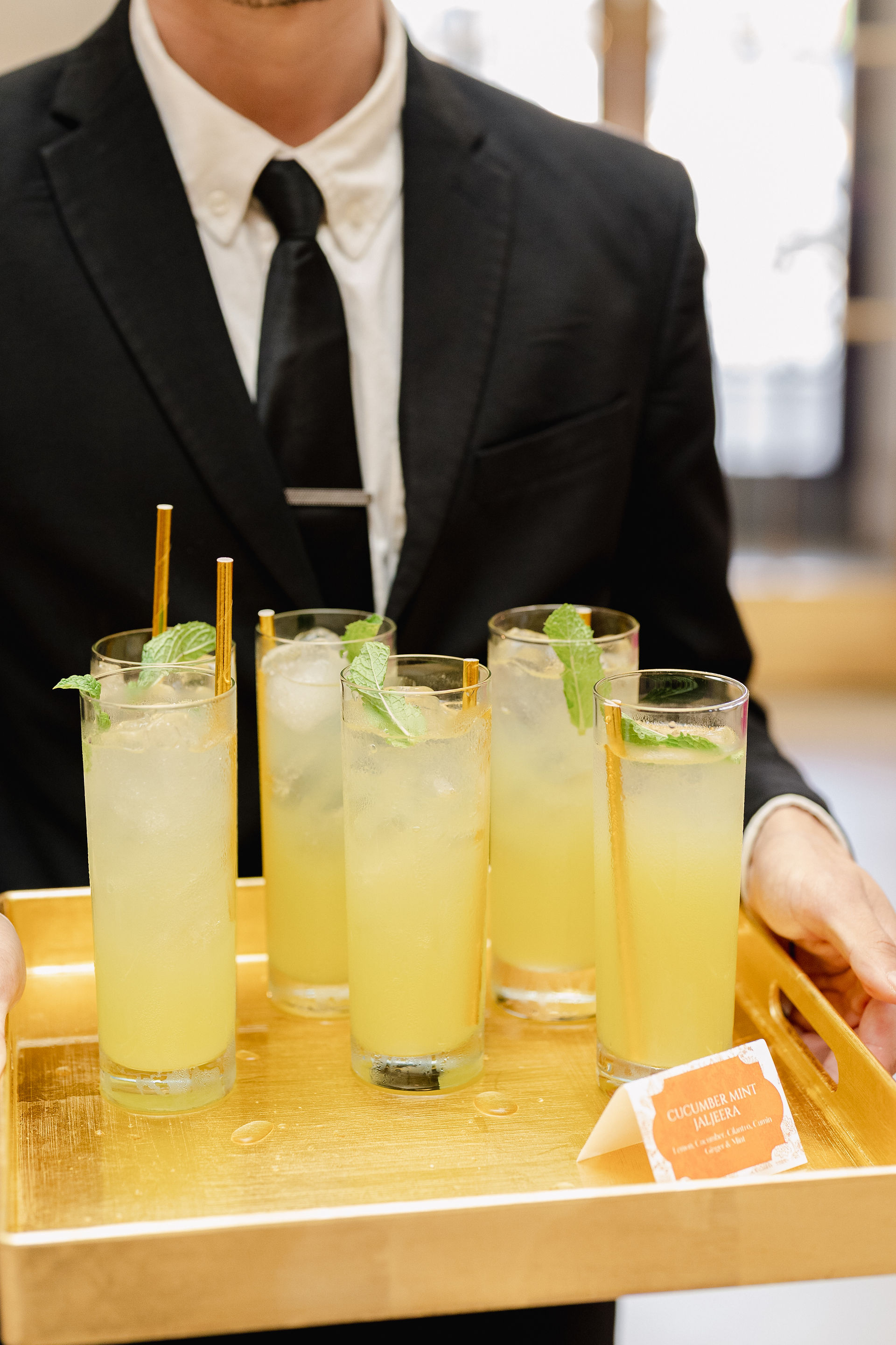 Ridgewells waiter serving specialty cocktails 
