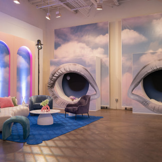 Lounge area with massive eye seats and quirky furniture