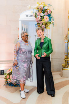 Gala guest using vintage phone booth installation