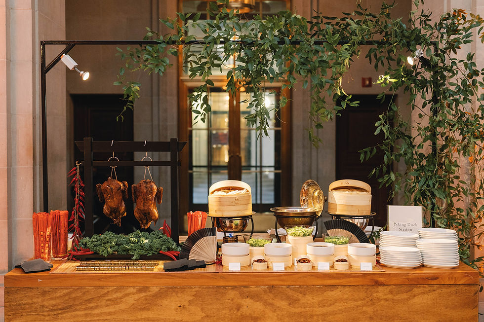Peking Duck station on wooden table with greenery