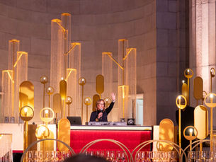 Ridgewells Catering CEO, Susan Lacz giving opening remarks at Mellon Auditorium Golden Hour Soiree