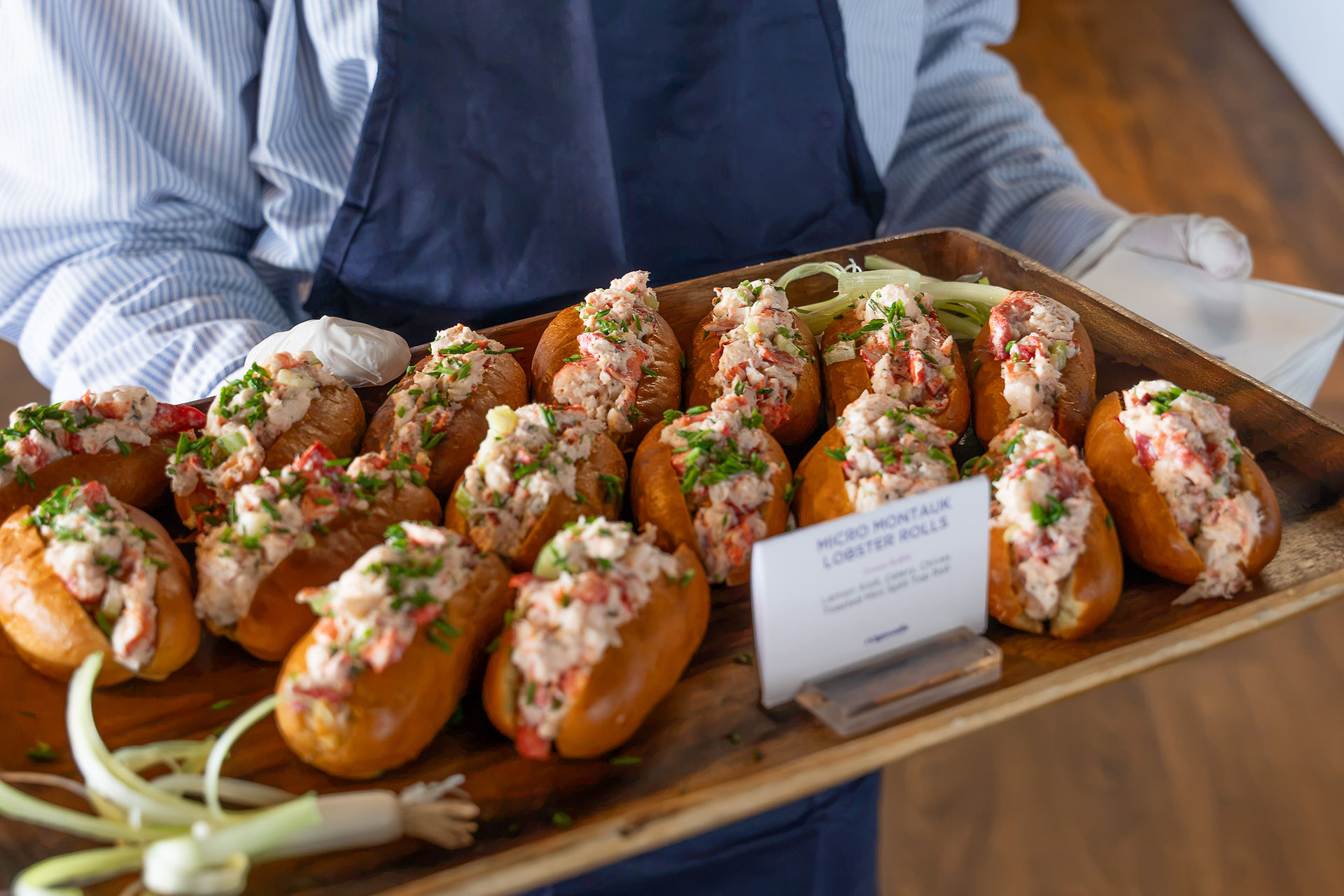 Mini lobster rolls on a large serving tray
