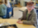 student smiling in classroom