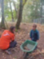 student with wheel barrel