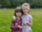 Two girls smiling at camera