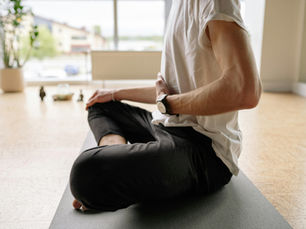 Expat man practicing meditation and breathing to navigate life abroad stress