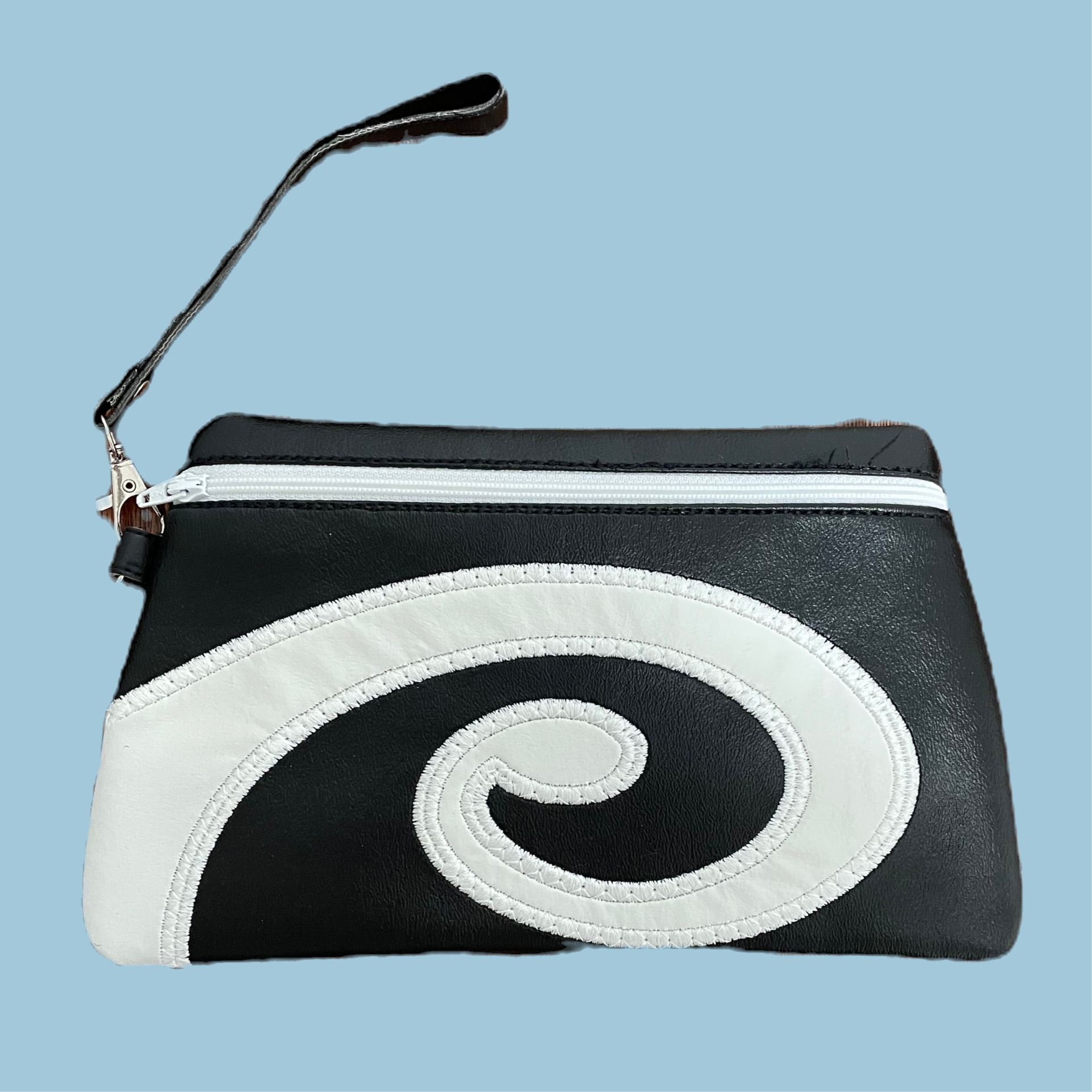 embroidered vinyl clutch black and white koru design