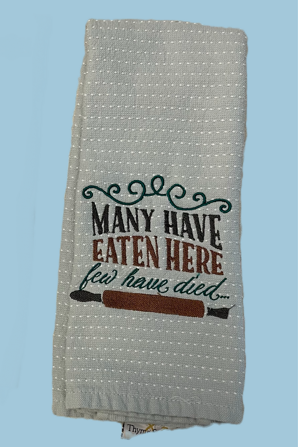 embroidered gray kitchen towel- Many Have Eaten Here