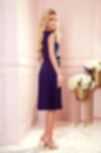 Woman in crepe dress in luxury hotel lobby