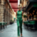 Lady in lovely green block color outfit with gold shoes by Vivien Lauren