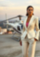 Model wears a cream suit by Vivien Lauren