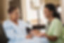 in home caregiver performing medical checkup on senior