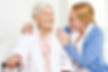 caregiver and senior smiling