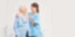 female caregiver and senior hugging