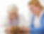 caregiver and senior looking at photo album